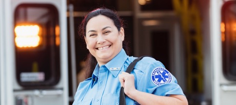 Paramedic in front of an ambulence