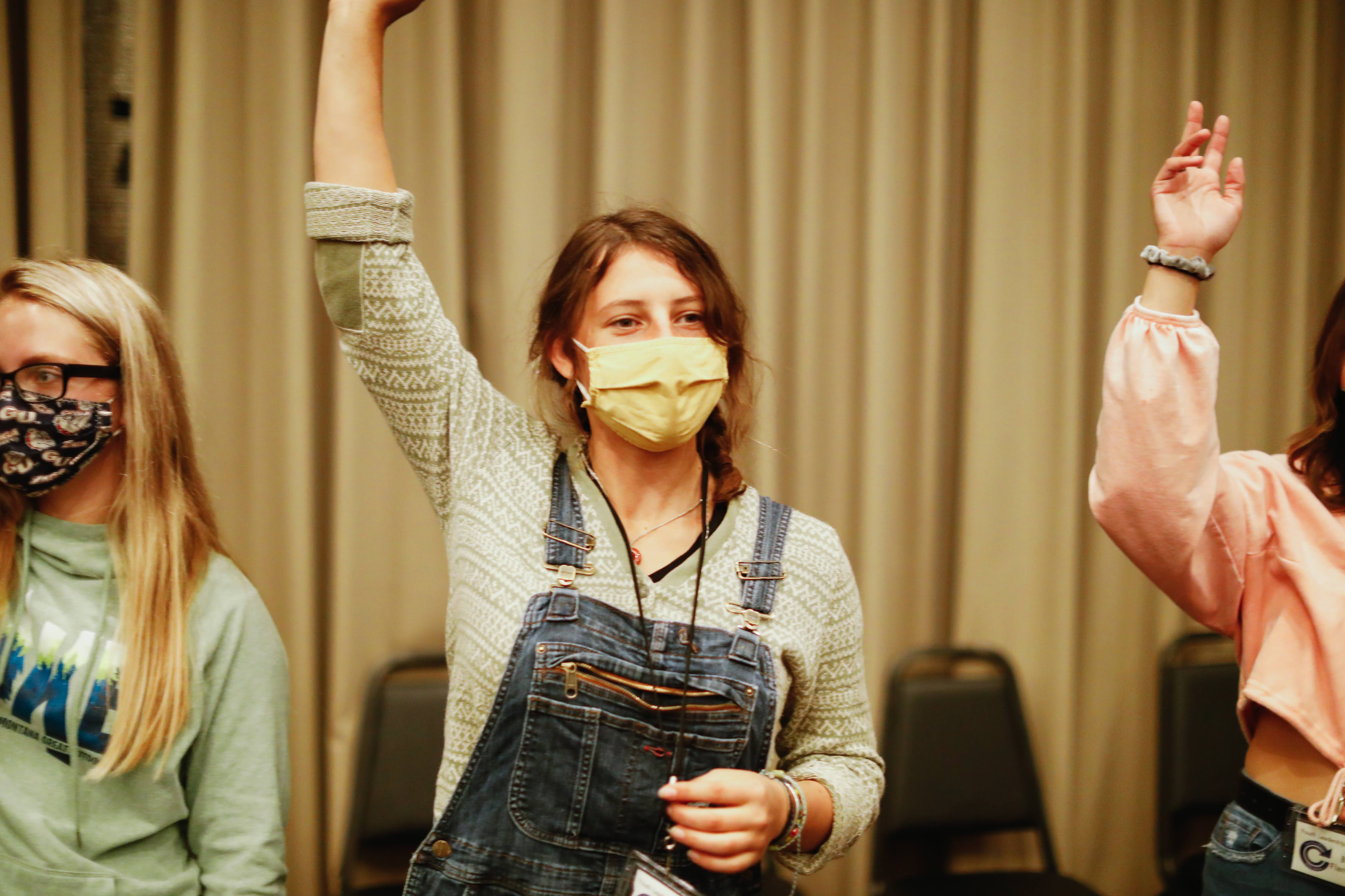 Student raising her hand