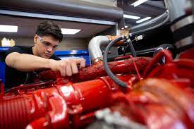 Student working on diesel engine